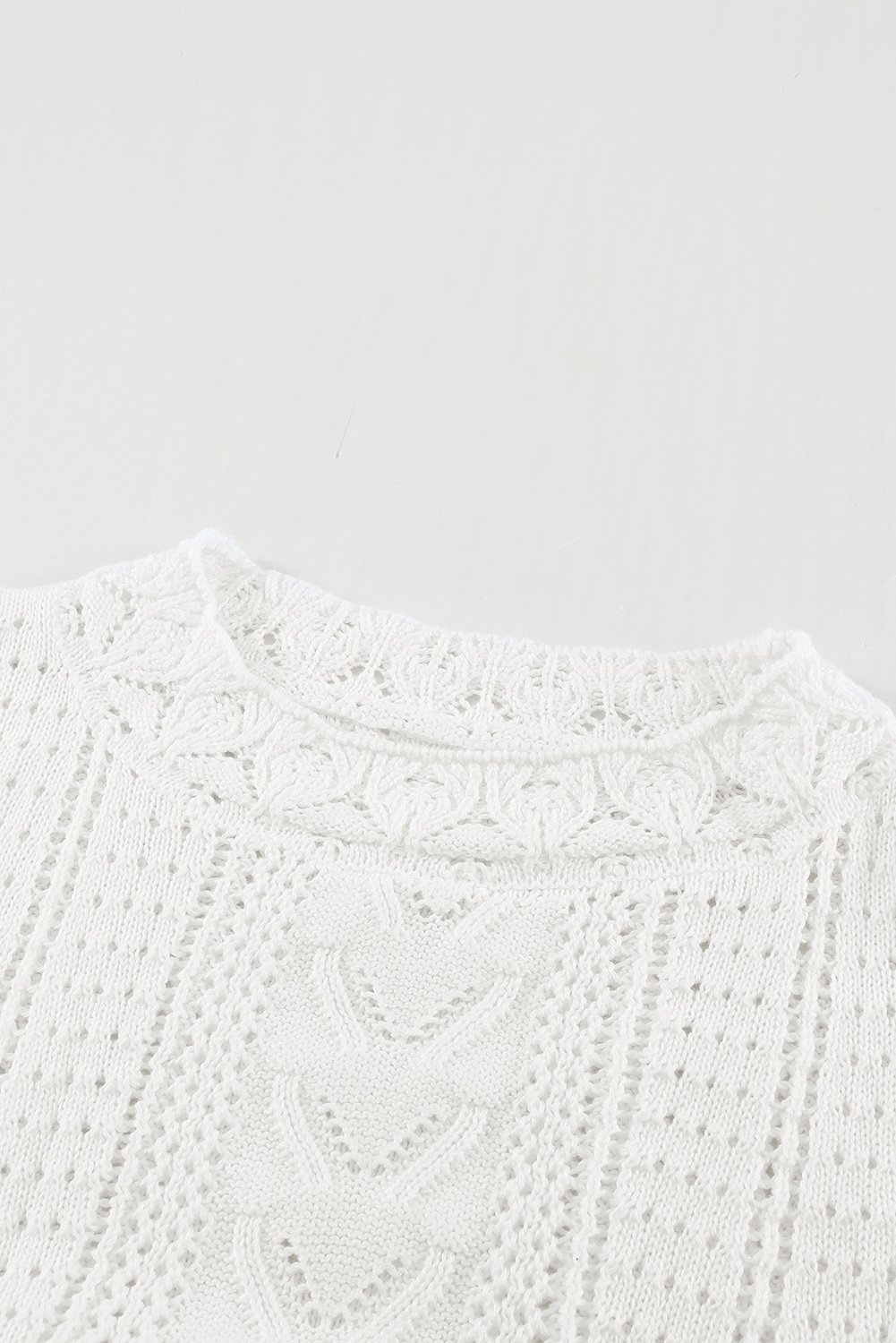 Chic White Crochet Lace Pointelle Knit Sweater featuring scalloped neckline and lace sleeves, perfect for winter fashion.