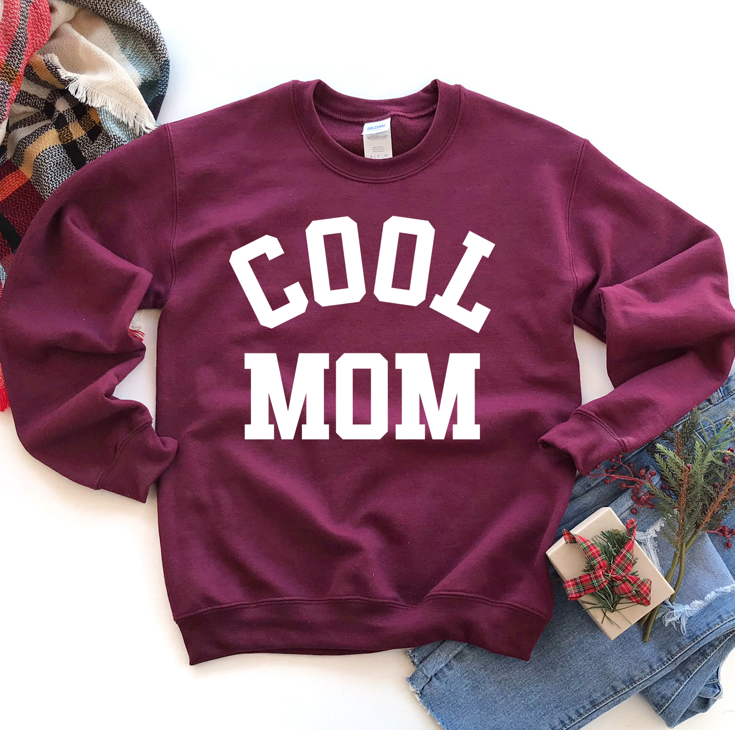 A stylish Cool Mom Sweatshirt in a cozy fabric, featuring a crew neck and rib-knit collar, perfect for casual wear.