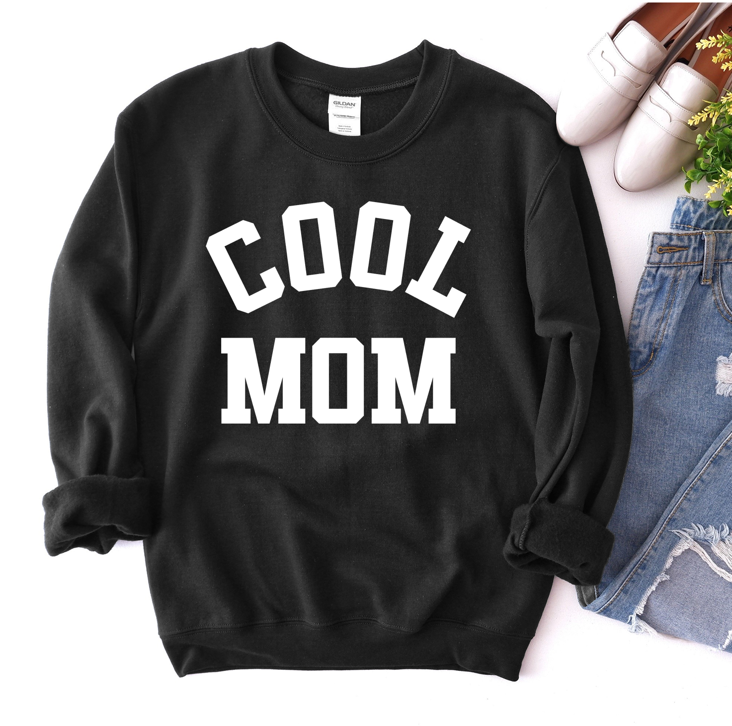 A stylish Cool Mom Sweatshirt in a cozy fabric, featuring a crew neck and rib-knit collar, perfect for casual wear.