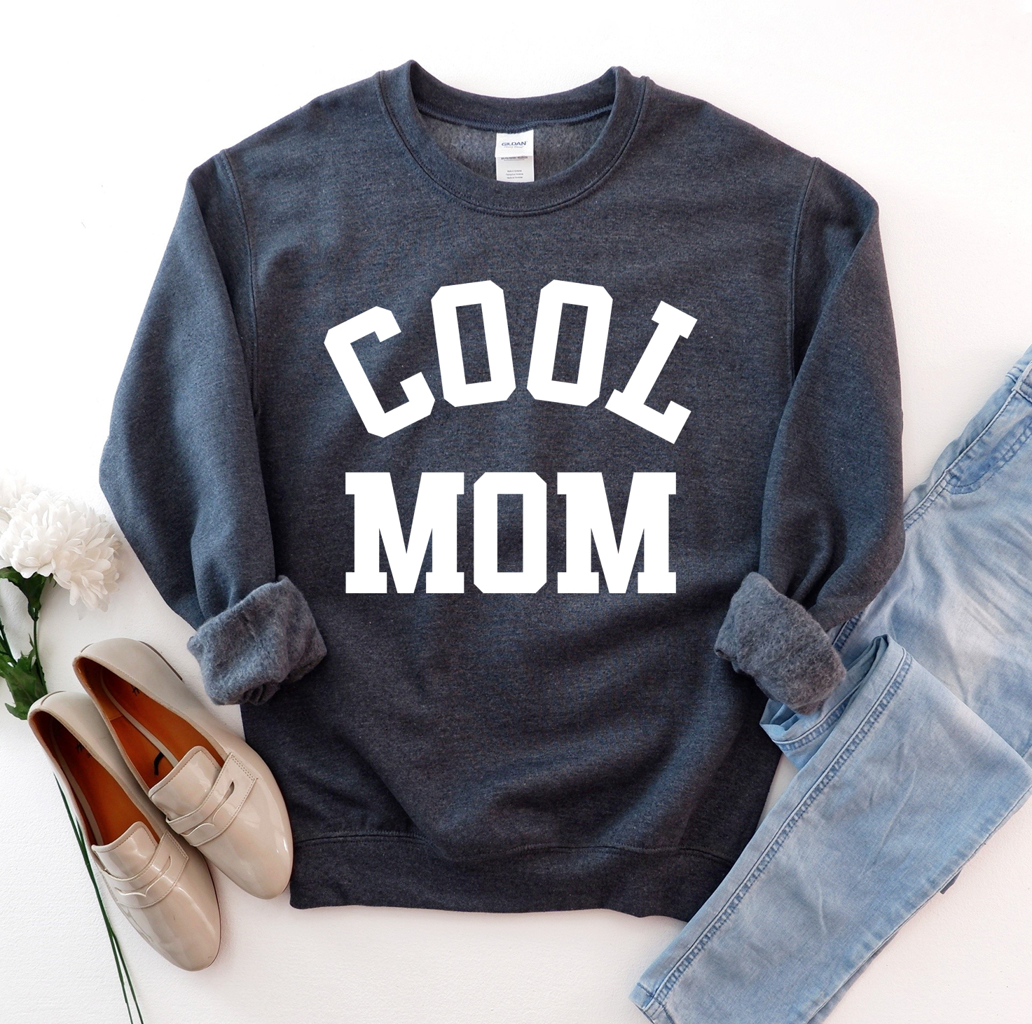 A stylish Cool Mom Sweatshirt in a cozy fabric, featuring a crew neck and rib-knit collar, perfect for casual wear.