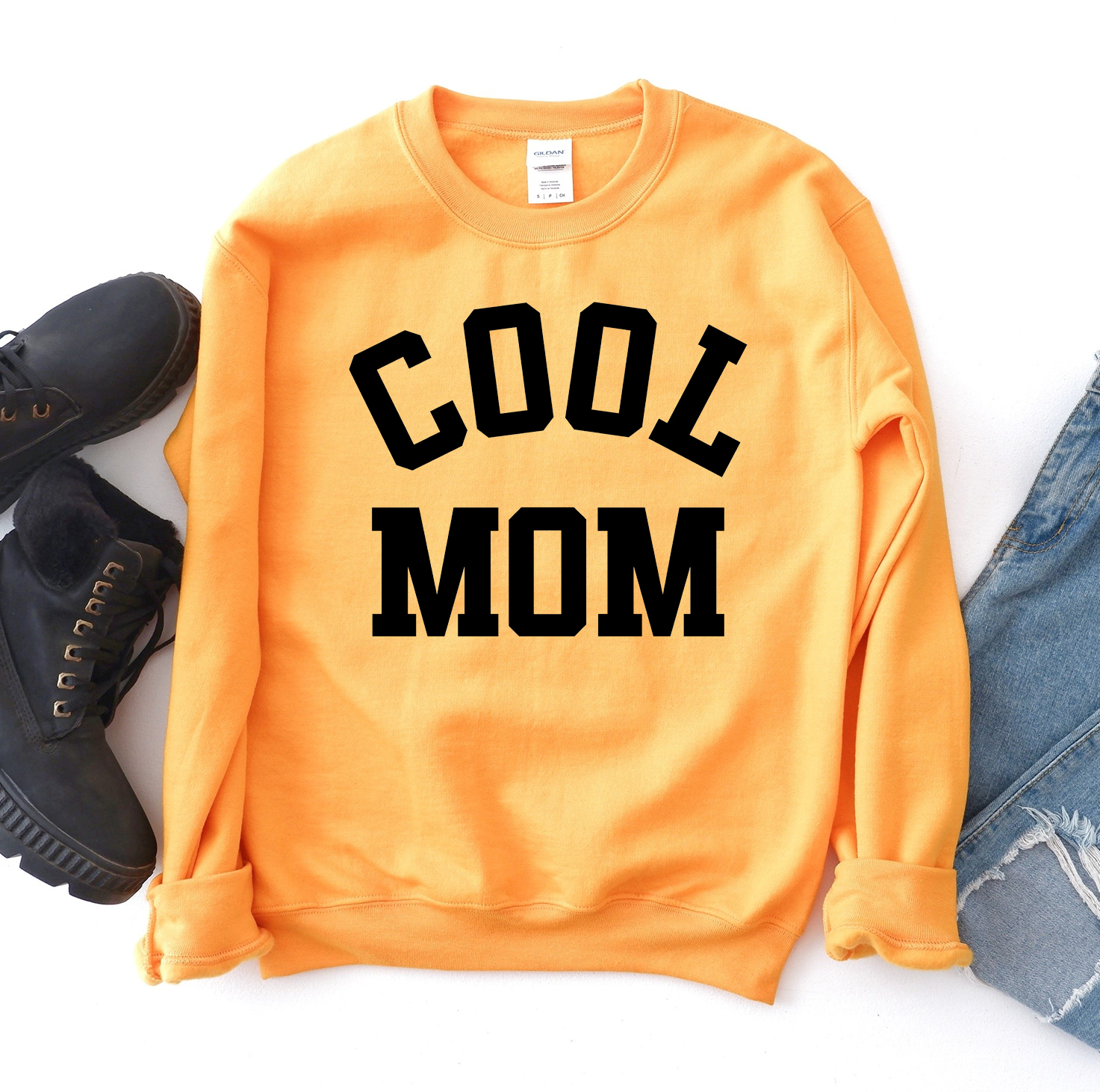 A stylish Cool Mom Sweatshirt in a cozy fabric, featuring a crew neck and rib-knit collar, perfect for casual wear.