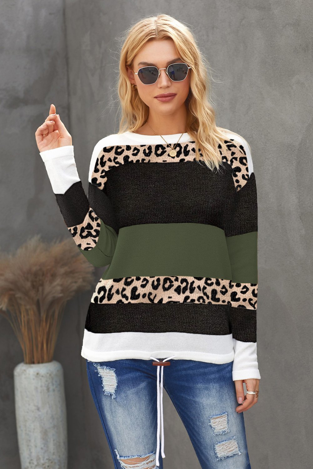 A stylish Color Block Knit Sweater featuring a chic leopard pattern and vibrant colors, perfect for fall and winter wear.