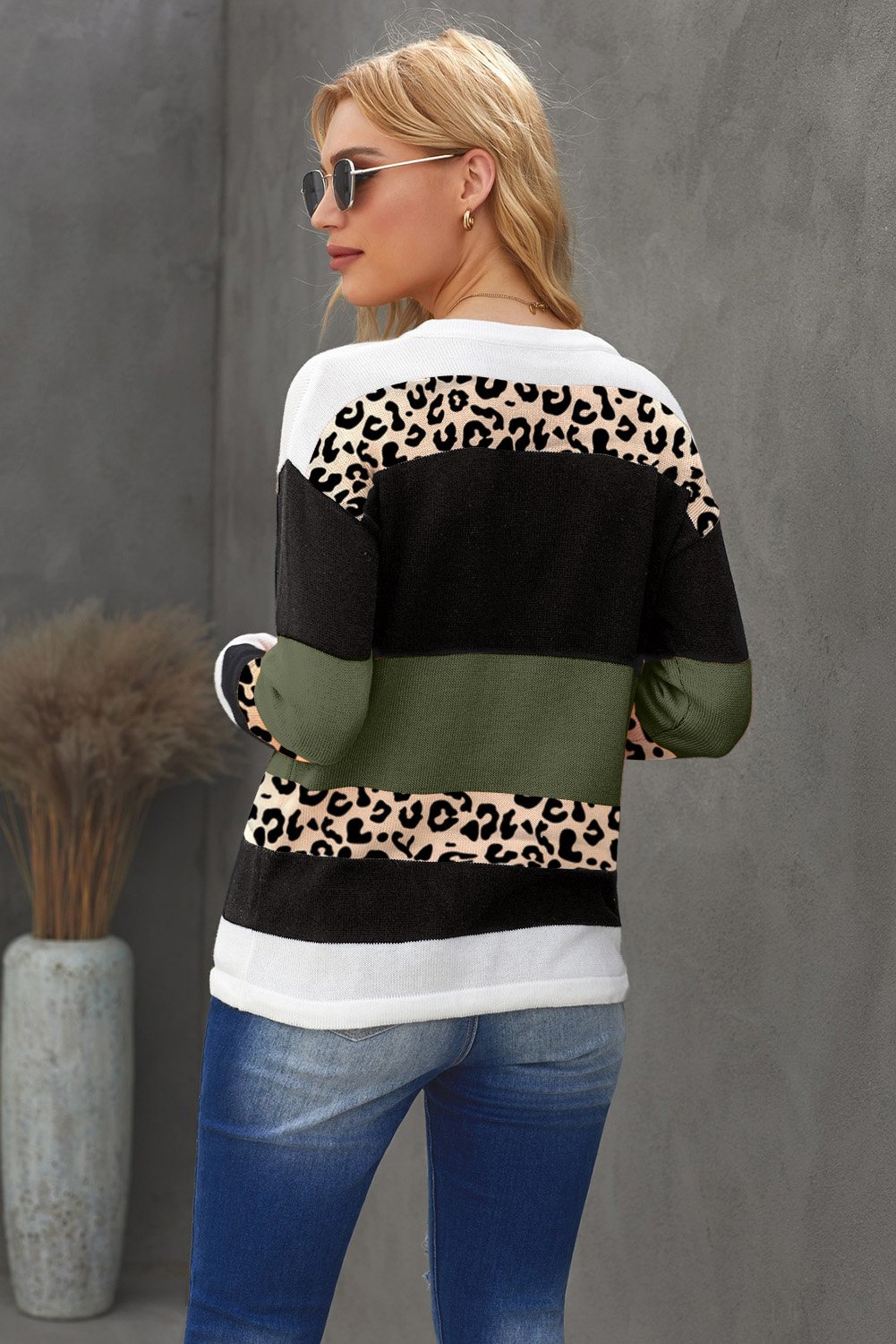 A stylish Color Block Knit Sweater featuring a chic leopard pattern and vibrant colors, perfect for fall and winter wear.