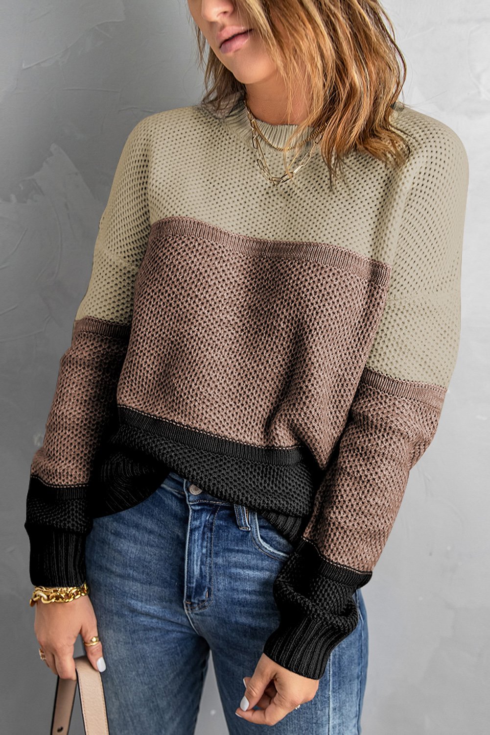 A stylish khaki color block pullover sweater for women, featuring full sleeves and a comfortable knit material.