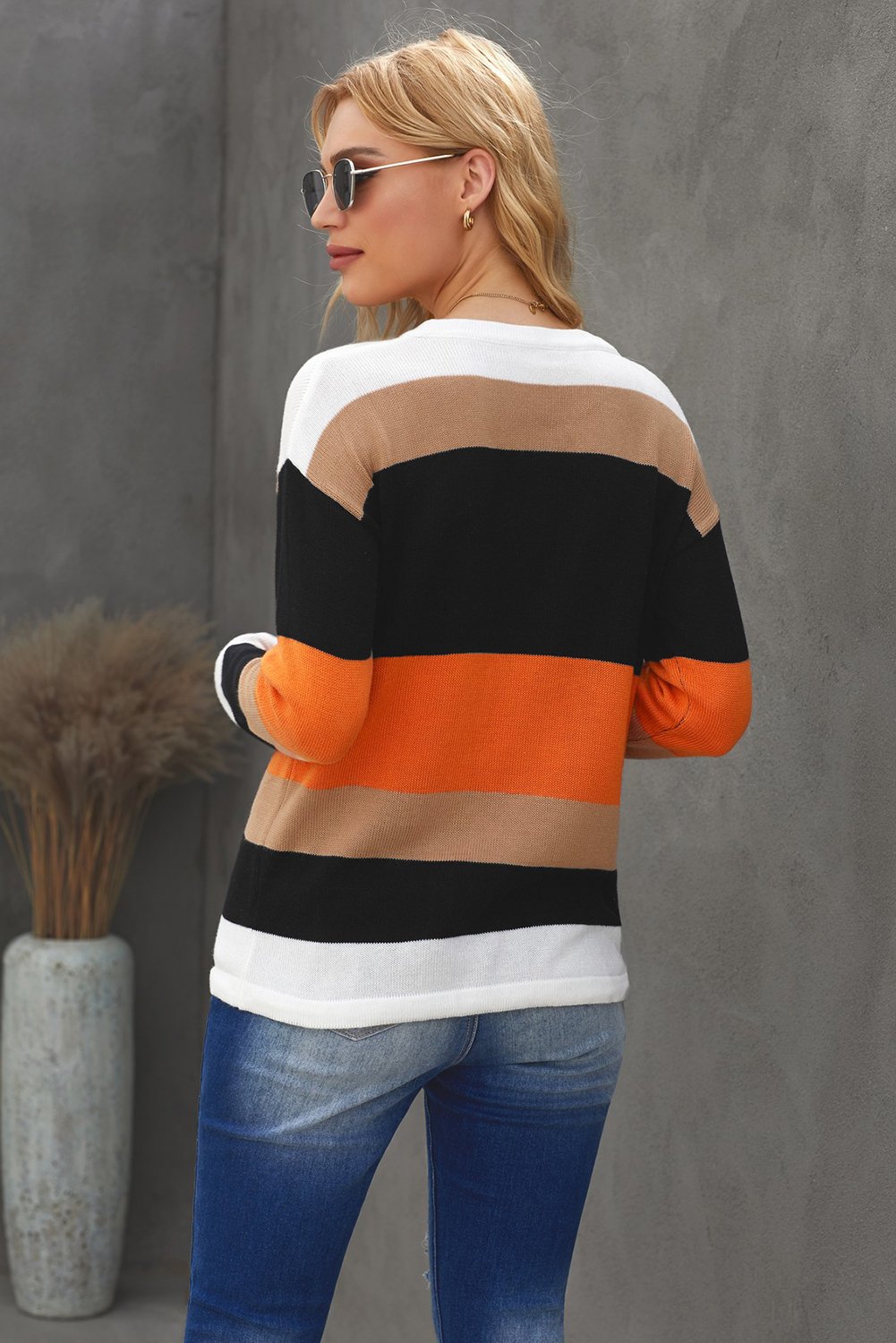 Colorblock Knit Sweater featuring a vibrant design in orange, showcasing a round neck and full sleeves, perfect for casual wear.