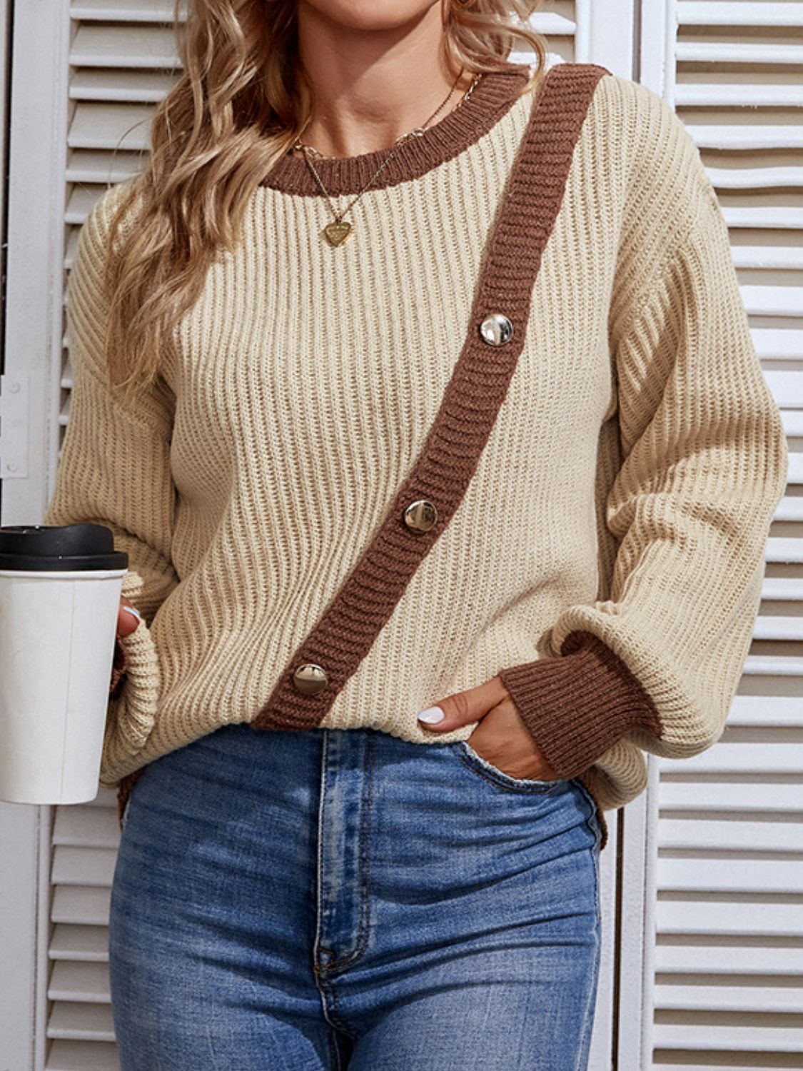 A stylish Contrast Button Detail Rib-Knit Sweater featuring a ribbed texture, round neck, and lantern sleeves, available in multiple colors.