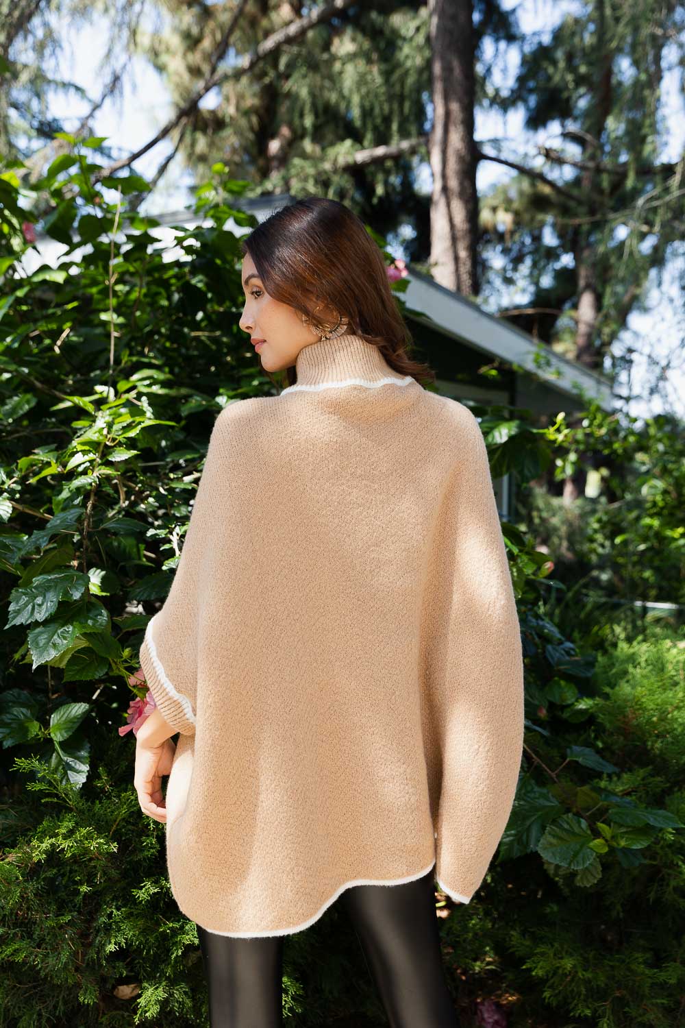 CozyCove Turtle Neck Poncho in soft polyester, featuring a snug turtle neck and easy sleeves, perfect for stylish comfort.