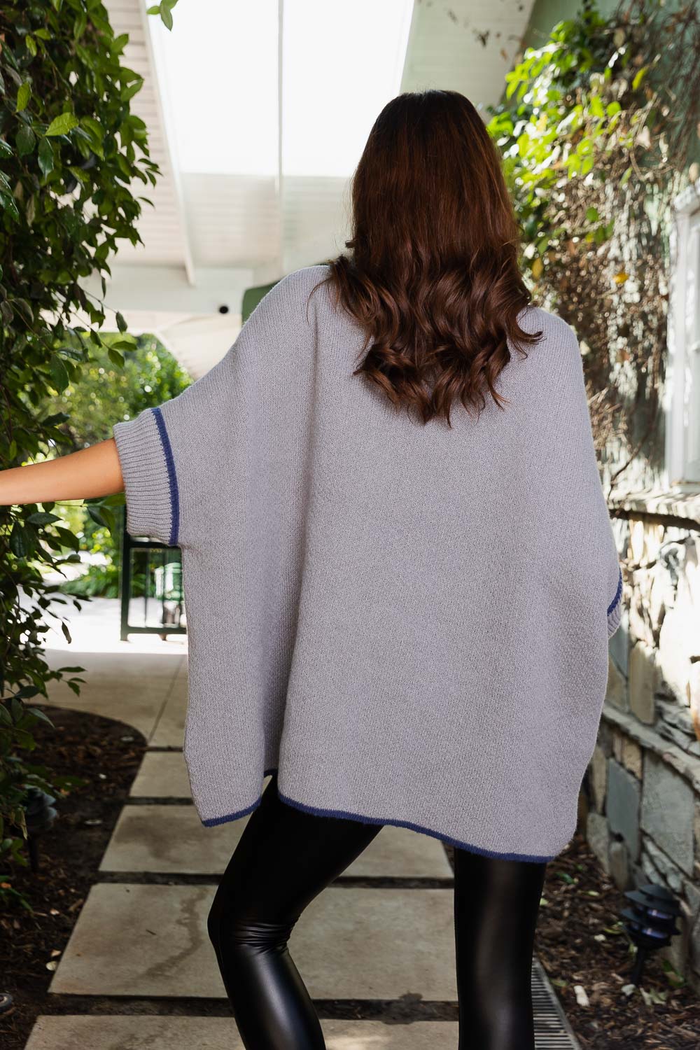 CozyCove Turtle Neck Poncho in soft polyester, featuring a snug turtle neck and easy sleeves, perfect for stylish comfort.