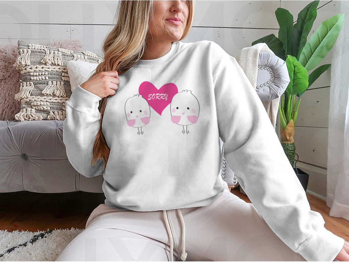 Cute bird design with a red heart and the word 'Sorry' on a comfortable shirt.