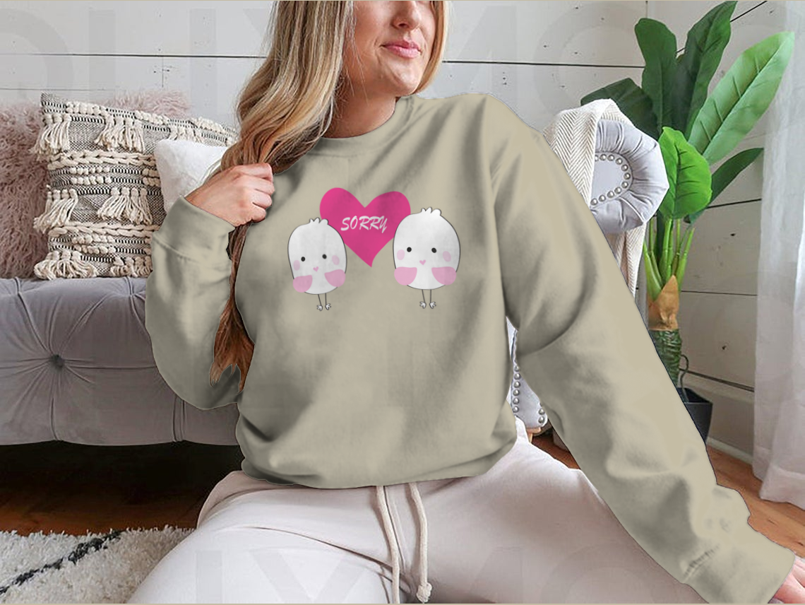 Cute bird design with a red heart and the word 'Sorry' on a comfortable shirt.