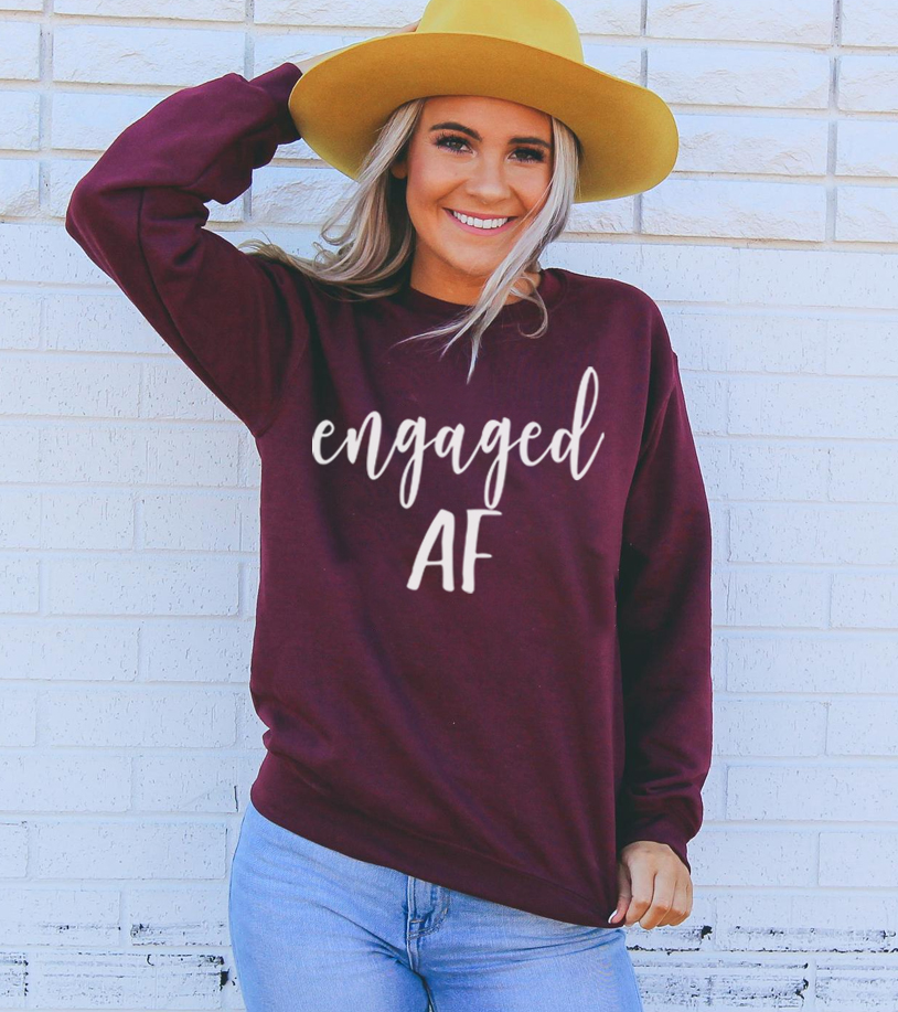 Engaged AF Sweatshirt in a cozy unisex design, featuring a crew neck and soft fabric blend.