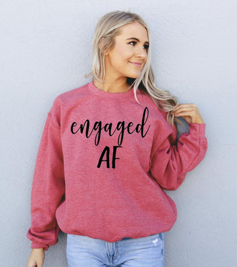 Engaged AF Sweatshirt in a cozy unisex design, featuring a crew neck and soft fabric blend.