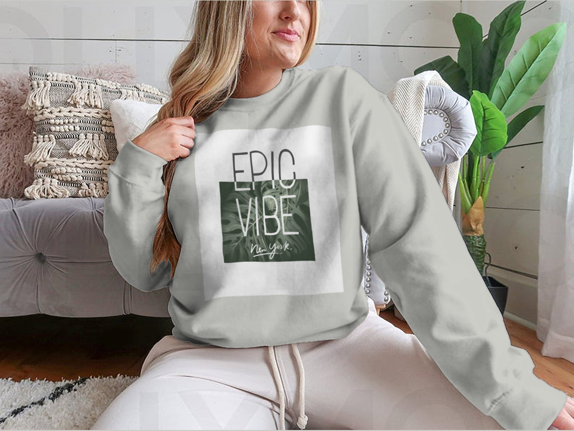 Epic Vibe Slogan T-shirt featuring a colorful tropical leaf background, made from 100% cotton for comfort and style.