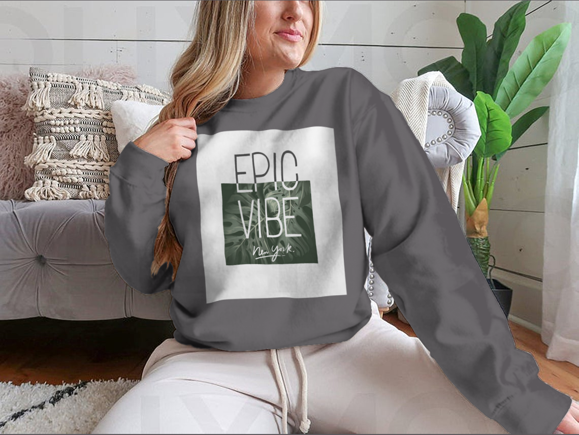 Epic Vibe Slogan T-shirt featuring a colorful tropical leaf background, made from 100% cotton for comfort and style.