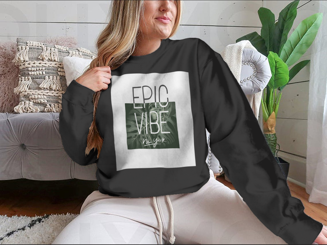 Epic Vibe Slogan T-shirt featuring a colorful tropical leaf background, made from 100% cotton for comfort and style.