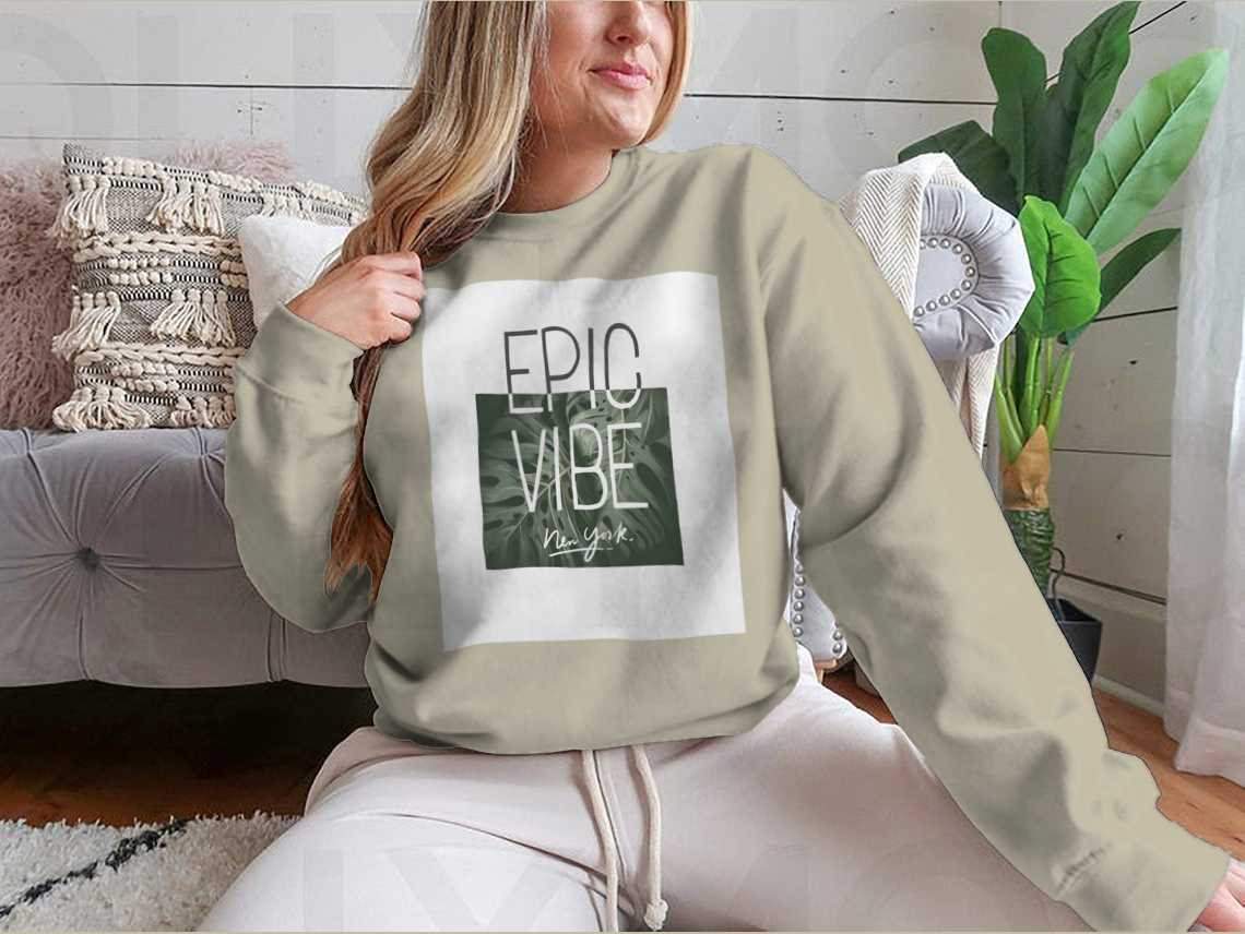 Epic Vibe Slogan T-shirt featuring a colorful tropical leaf background, made from 100% cotton for comfort and style.