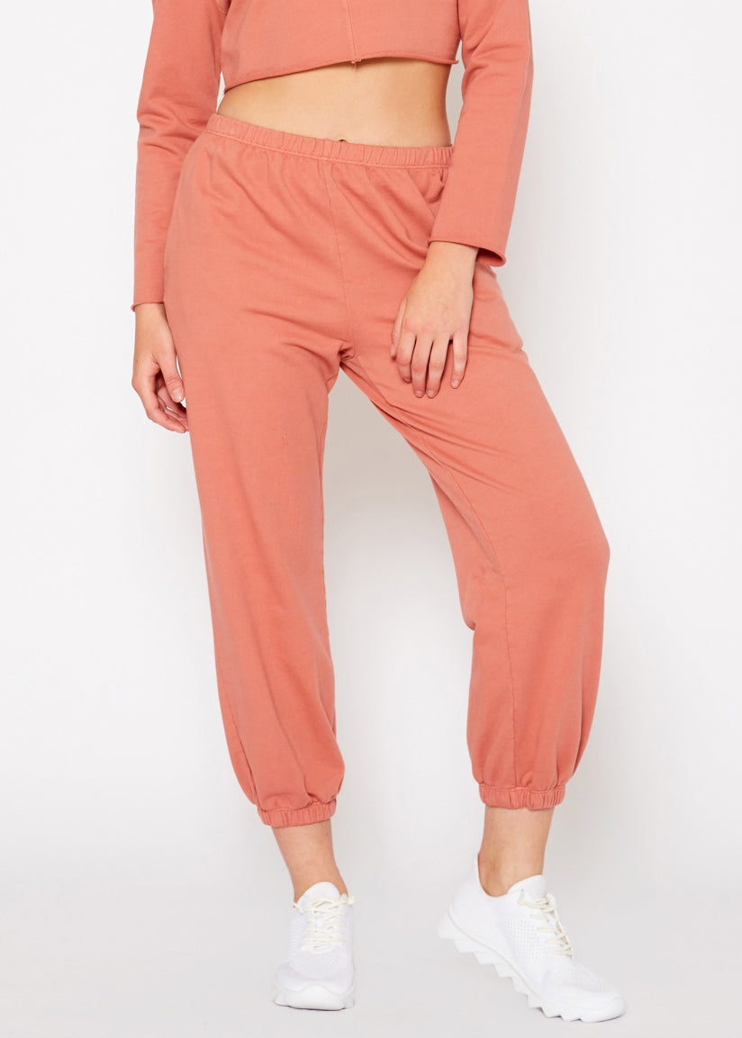 Essential French Terry Sweatpants in Rose with side slit pockets, showcasing a relaxed fit and natural dye.