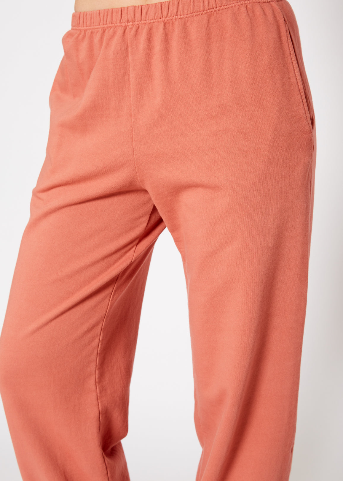 Essential French Terry Sweatpants in Rose with side slit pockets, showcasing a relaxed fit and natural dye.