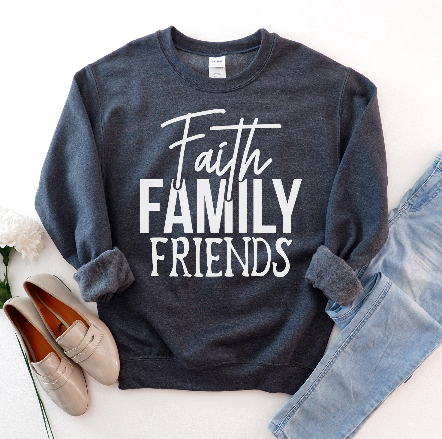 A cozy unisex sweatshirt featuring the phrase 'Faith Family Friends' in stylish lettering, perfect for casual wear.