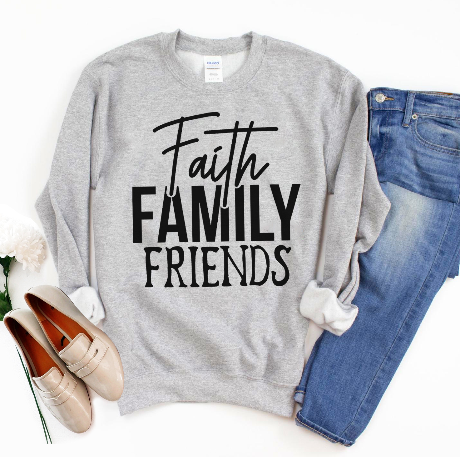 A cozy unisex sweatshirt featuring the phrase 'Faith Family Friends' in stylish lettering, perfect for casual wear.