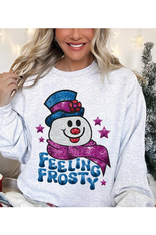 Feeling Frosty Fleece Sweatshirt featuring a festive design, oversized fit, and long sleeves, made from a soft cotton-polyester blend.