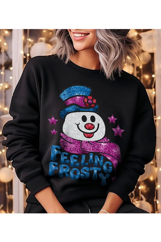 Feeling Frosty Fleece Sweatshirt featuring a festive design, oversized fit, and long sleeves, made from a soft cotton-polyester blend.