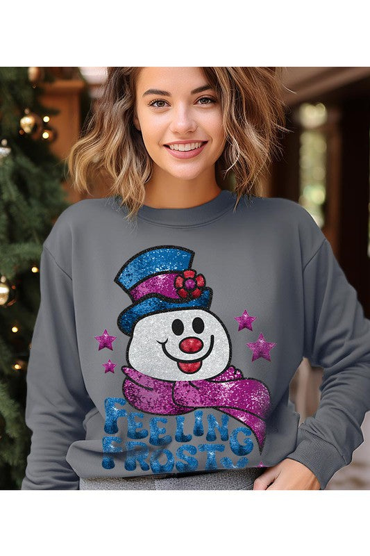 Feeling Frosty Fleece Sweatshirt featuring a festive design, oversized fit, and long sleeves, made from a soft cotton-polyester blend.