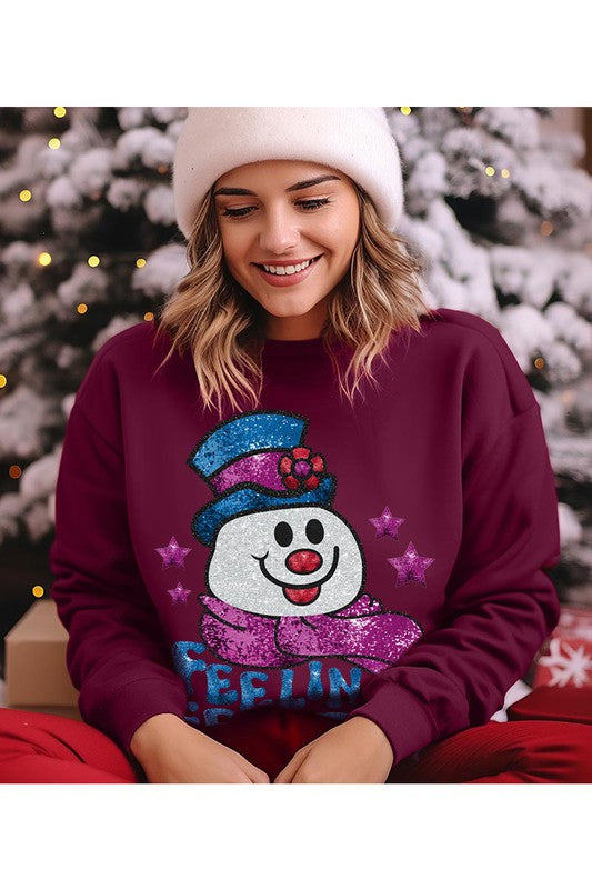 Feeling Frosty Fleece Sweatshirt featuring a festive design, oversized fit, and long sleeves, made from a soft cotton-polyester blend.