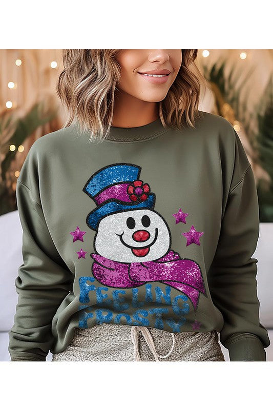 Feeling Frosty Fleece Sweatshirt featuring a festive design, oversized fit, and long sleeves, made from a soft cotton-polyester blend.