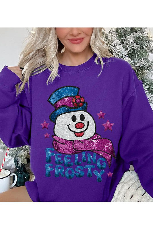 Feeling Frosty Fleece Sweatshirt featuring a festive design, oversized fit, and long sleeves, made from a soft cotton-polyester blend.