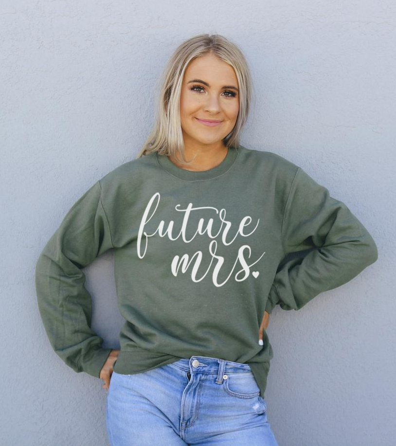 A cozy Future Mrs Sweatshirt in a soft fabric blend, featuring a crew neck and stylish design, perfect for brides-to-be.