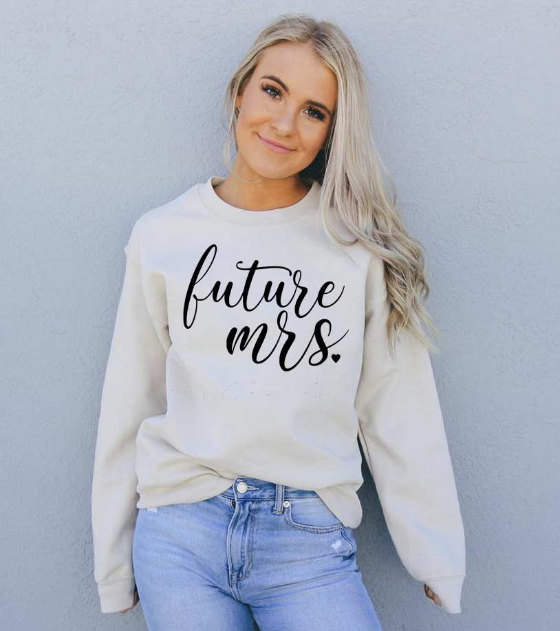 A cozy Future Mrs Sweatshirt in a soft fabric blend, featuring a crew neck and stylish design, perfect for brides-to-be.