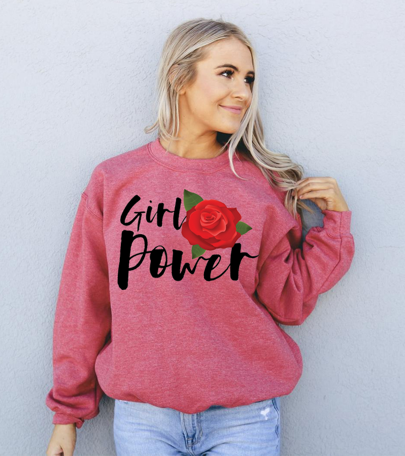 A cozy unisex sweatshirt featuring the empowering 'Girl Power' graphic, made from soft fabric with a classic crew neck design.