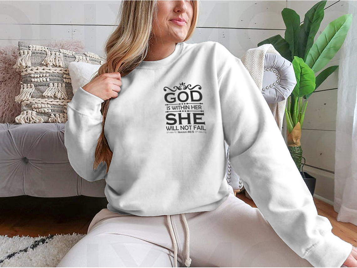 A stylish Christian cross shirt featuring the phrase 'God Is Within Her She Will Not Fail', made from soft cotton fabric.