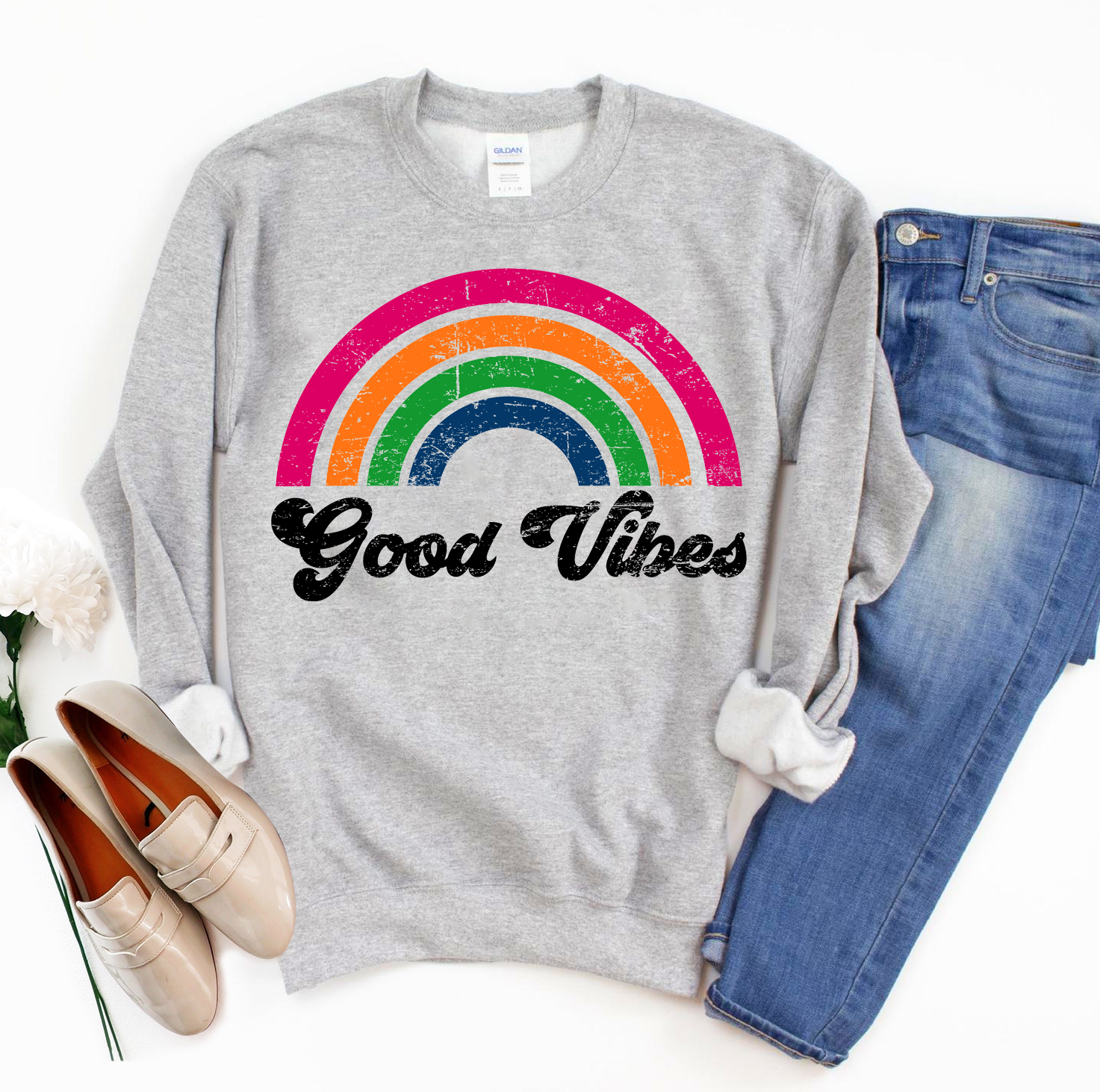 A cozy unisex Good Vibes Sweatshirt in a stylish design, featuring a crew neck and rib-knit collar, perfect for casual wear.