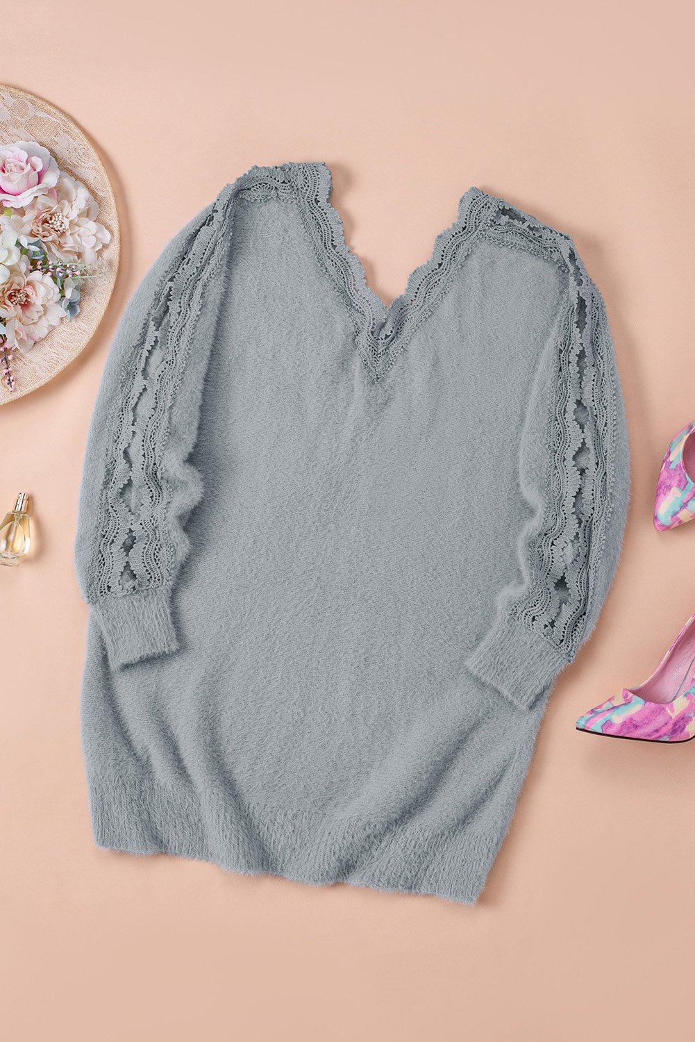 Gray lace splicing sweater featuring a v-neck and long sleeves, showcasing elegant lace details.