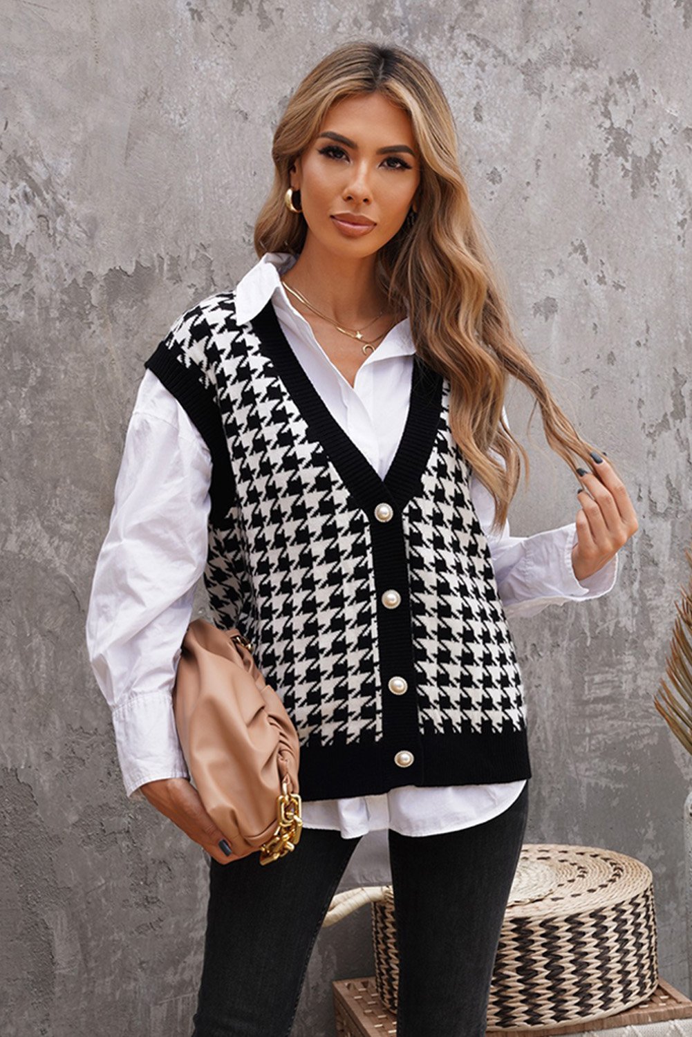 A stylish Houndstooth Vest Cardigan featuring a timeless pattern, button closure, and sleeveless design, available in black, green, and pink.