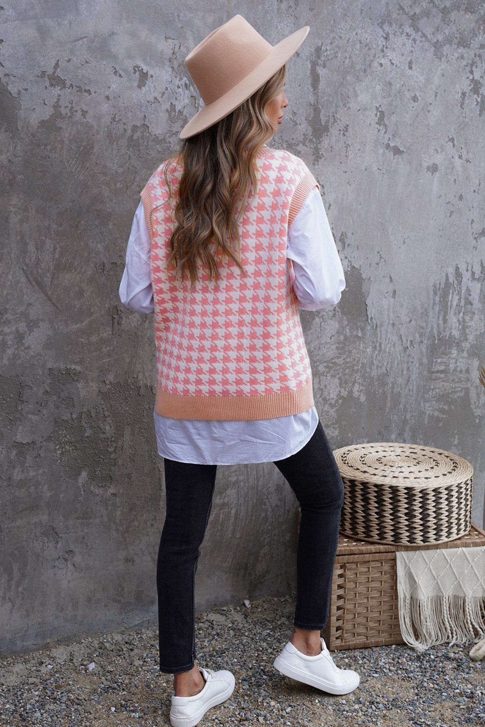 A stylish Houndstooth Vest Cardigan featuring a timeless pattern, button closure, and sleeveless design, available in black, green, and pink.