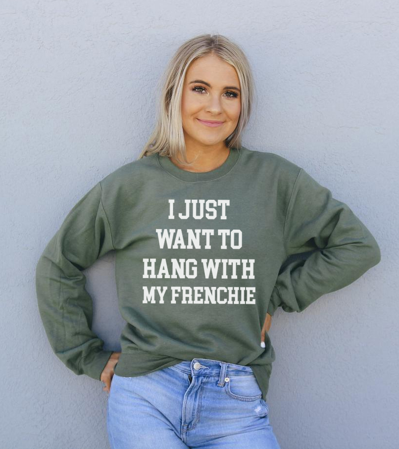 A cozy unisex sweatshirt featuring the phrase 'I Just Want To Hang With My Frenchie', perfect for dog lovers.