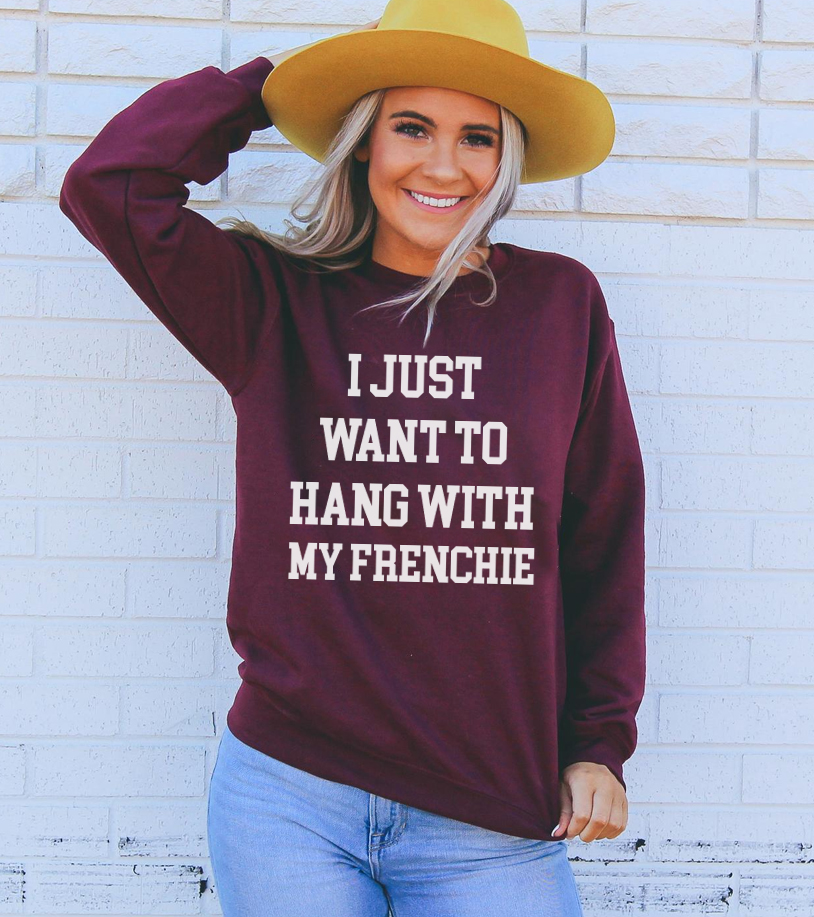 A cozy unisex sweatshirt featuring the phrase 'I Just Want To Hang With My Frenchie', perfect for dog lovers.