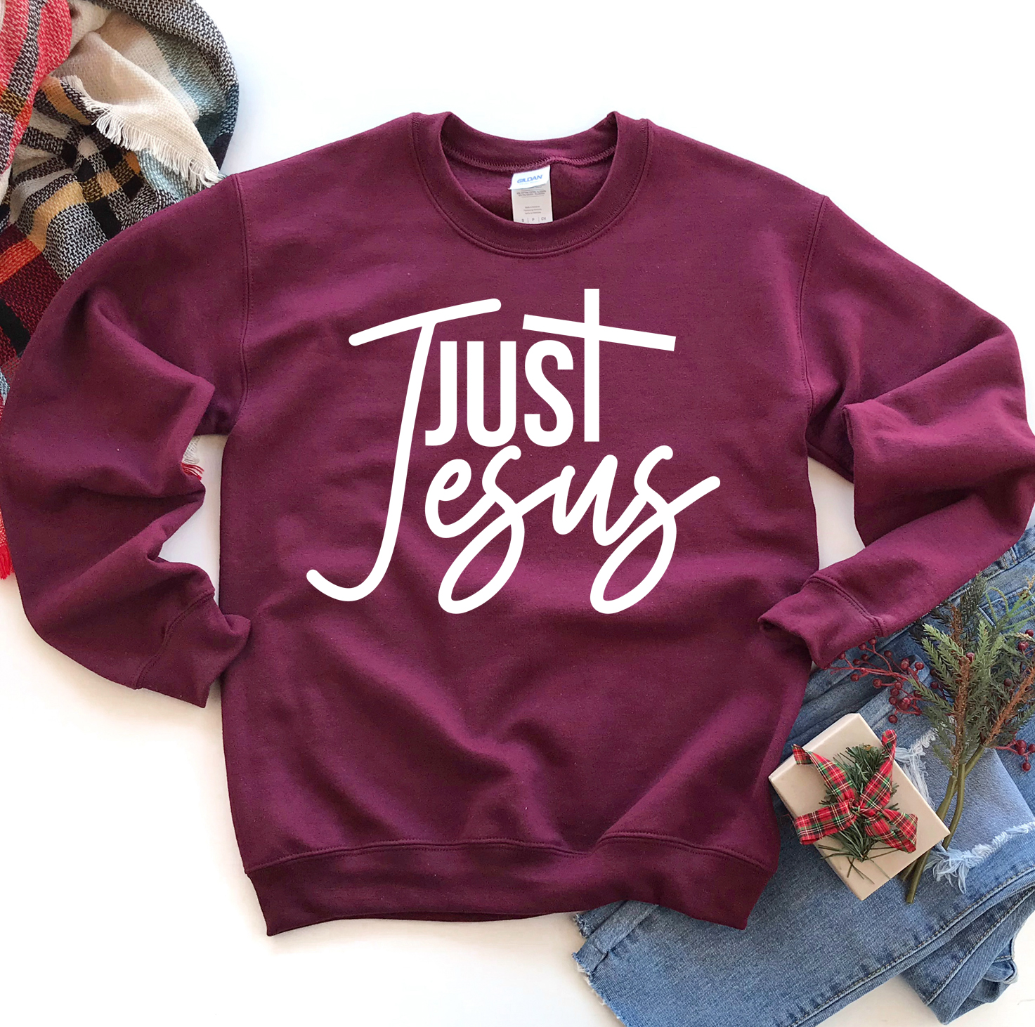 A cozy unisex Just Jesus Sweatshirt featuring a classic crew neck design, made from soft fabric blend, perfect for casual wear.