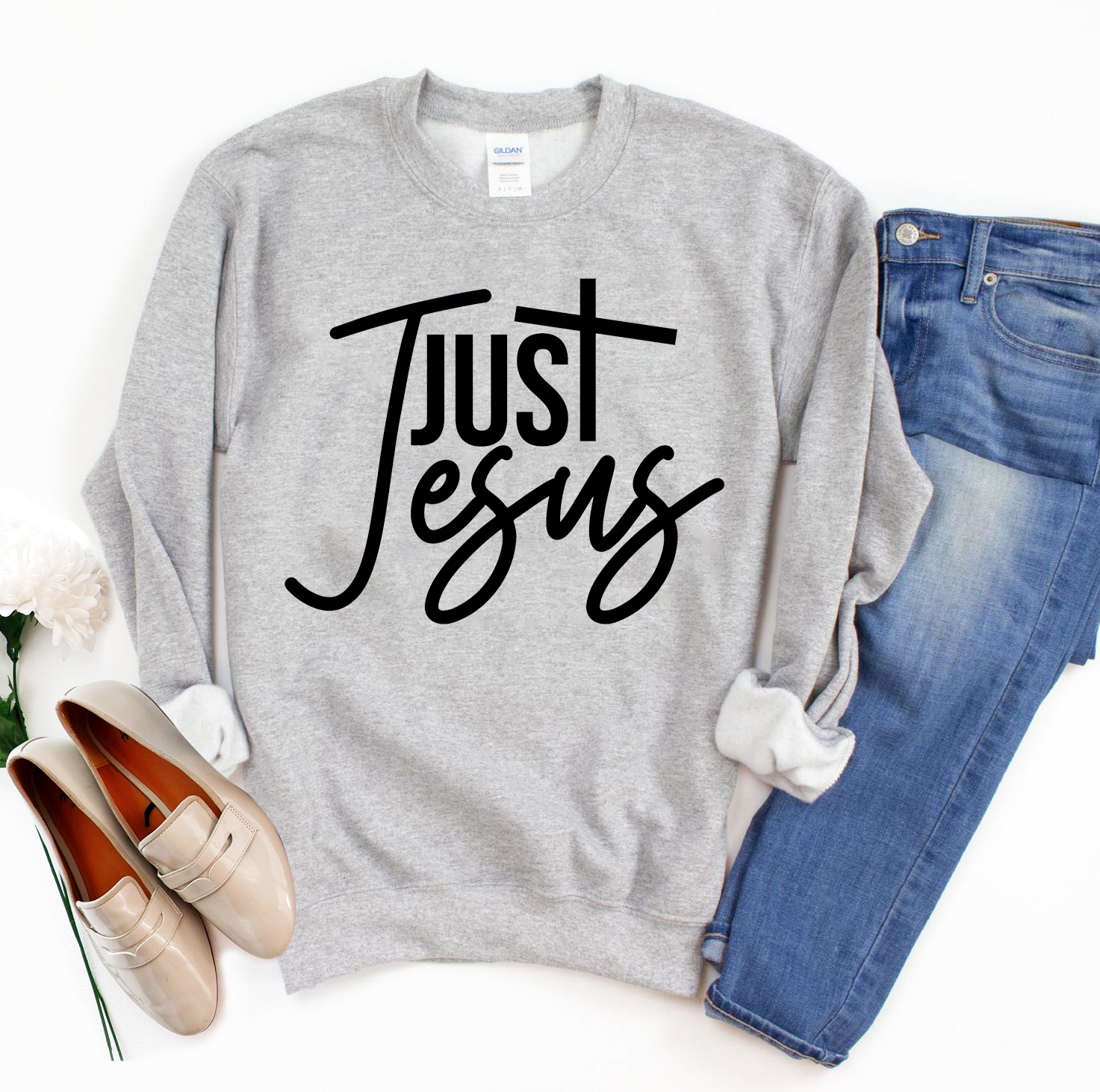 A cozy unisex Just Jesus Sweatshirt featuring a classic crew neck design, made from soft fabric blend, perfect for casual wear.