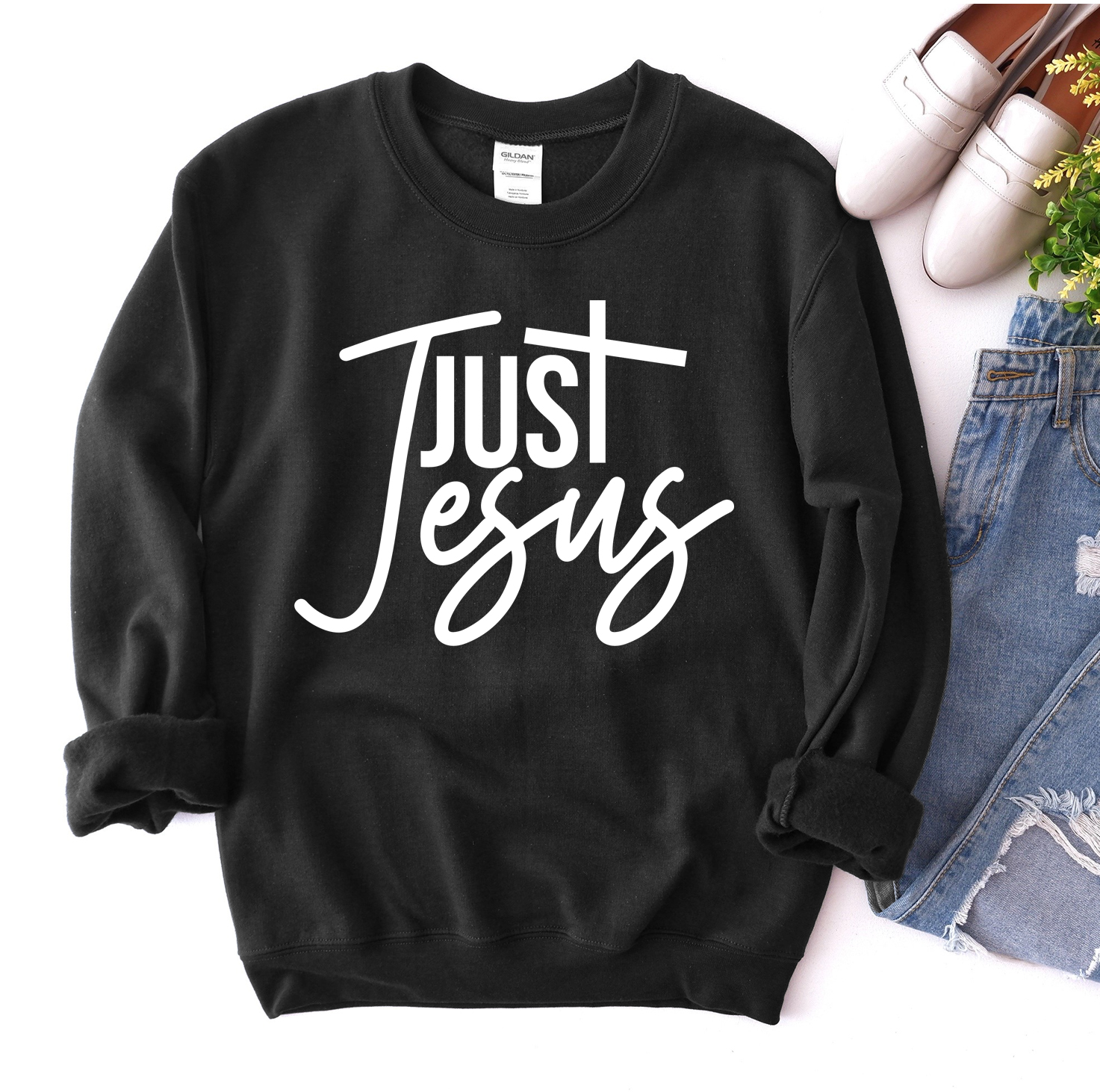 A cozy unisex Just Jesus Sweatshirt featuring a classic crew neck design, made from soft fabric blend, perfect for casual wear.