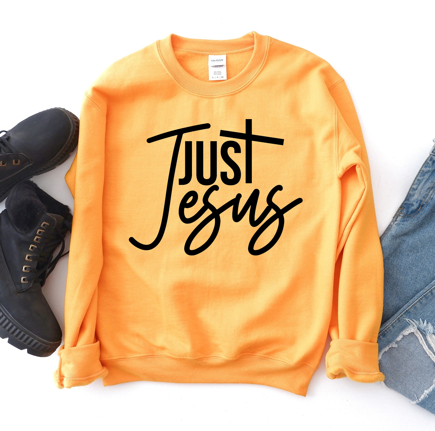 A cozy unisex Just Jesus Sweatshirt featuring a classic crew neck design, made from soft fabric blend, perfect for casual wear.