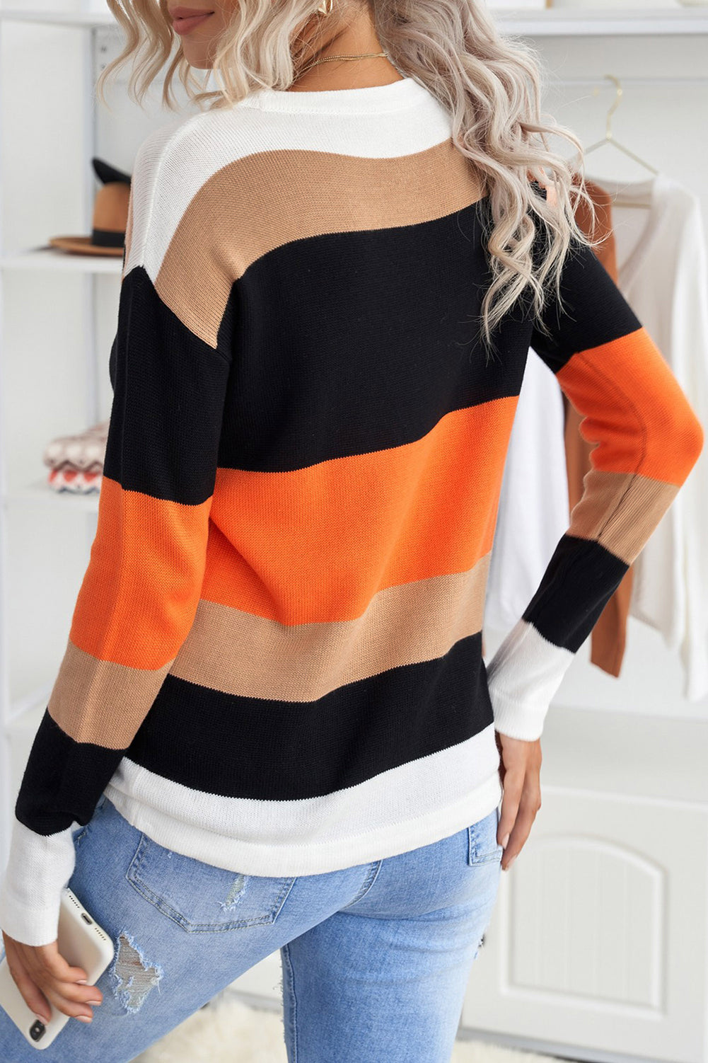 A stylish Knit Pullover Sweater featuring a chic leopard pattern and color block design, perfect for fall and winter wear.