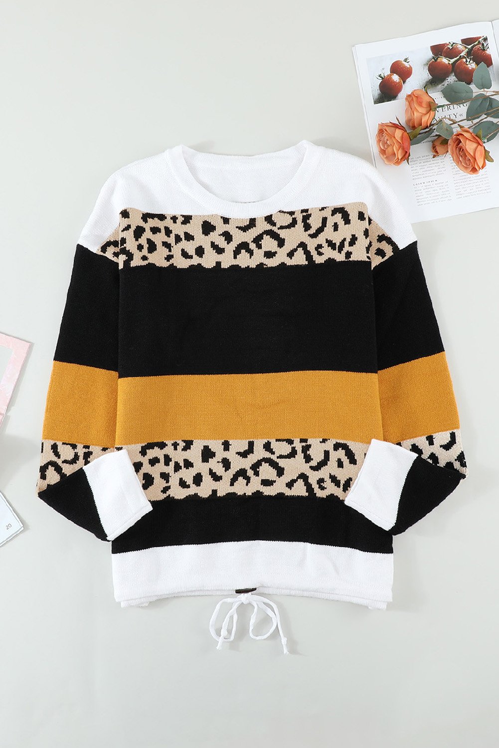 A stylish Knit Pullover Sweater featuring a chic leopard pattern and color block design, perfect for fall and winter wear.