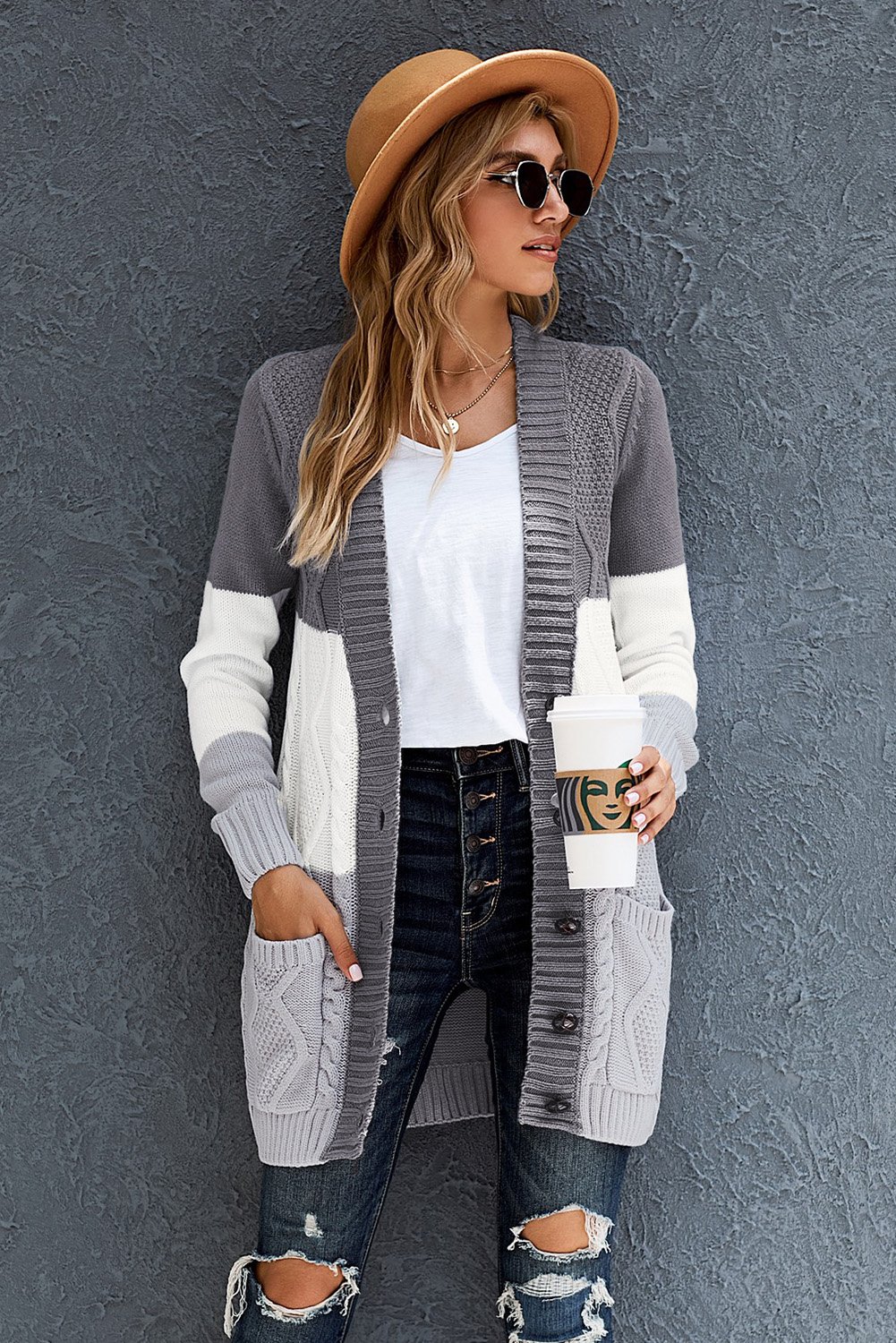 A stylish long women cardigan featuring a unique knit pattern, open front with button closure, and side pockets, perfect for winter wear.