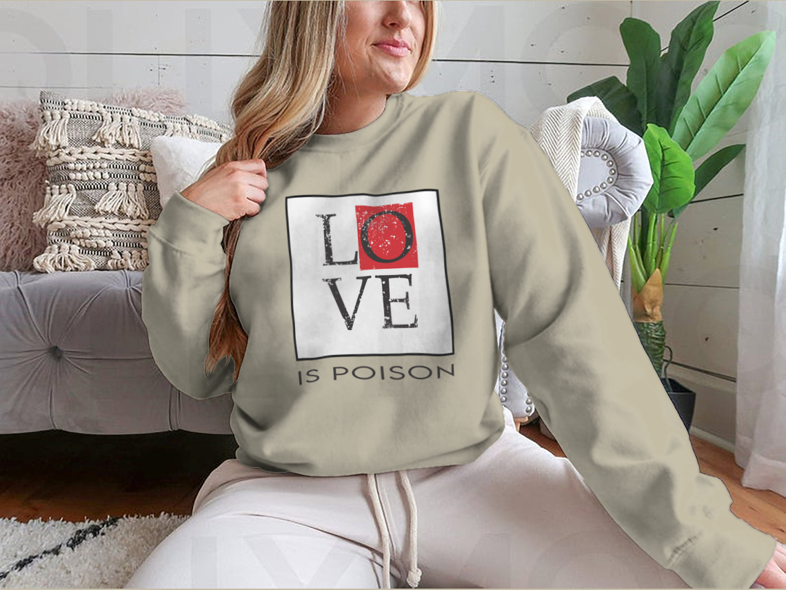 A stylish T-shirt featuring the bold 'Love Is Poison' graphic print, made from soft cotton fabric, perfect for casual wear.