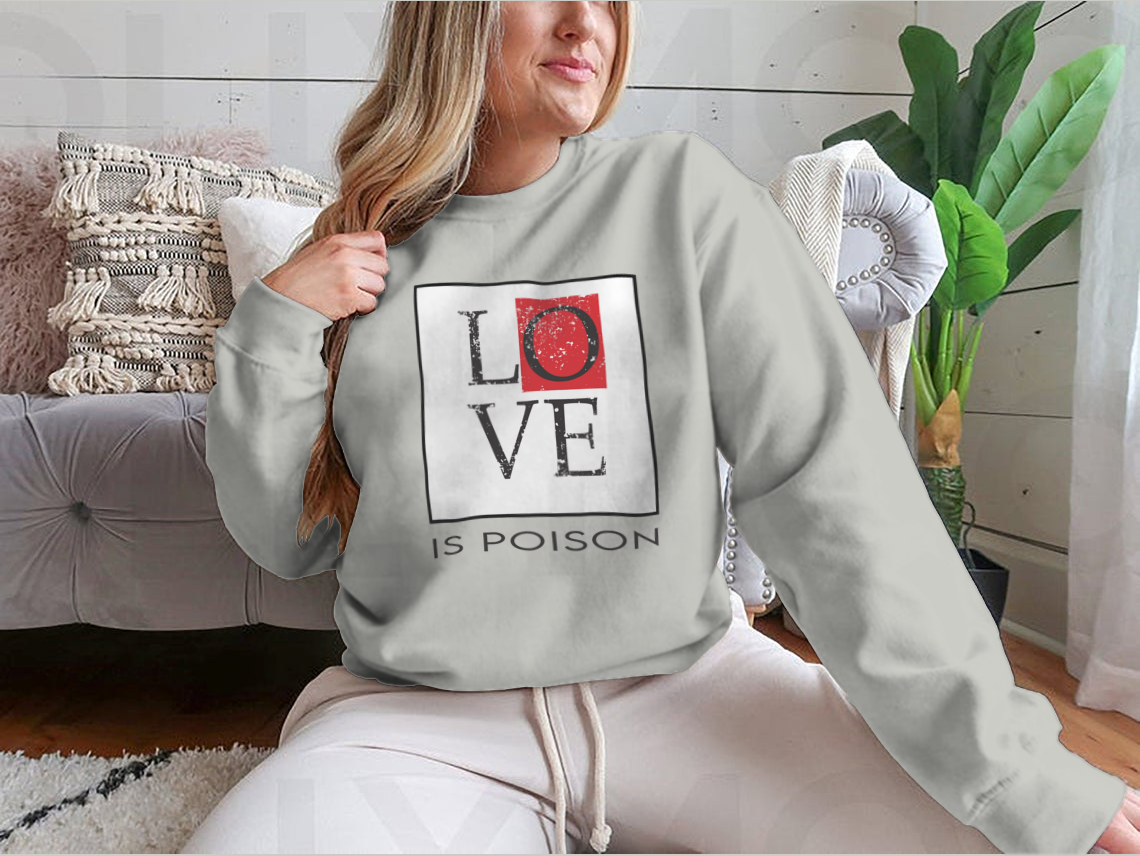 A stylish T-shirt featuring the bold 'Love Is Poison' graphic print, made from soft cotton fabric, perfect for casual wear.