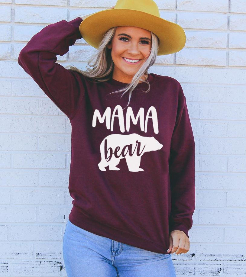 Cozy unisex Mama Bear Sweatshirt featuring a crew neck and soft fabric blend, perfect for casual wear.